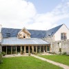 Steading conversion, Fife - oak framed glazed wall facing south in the courtyard