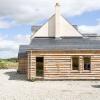 Larch cladding to steading conversion