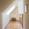 Southern light from the dormer is used to light the landing and hall below.