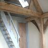 The central oak frame and painted soft wood staircase