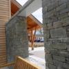 Hole in Denfind stone wall, looking towards Douglas Fir framed entrance structurel