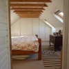 Ample bedroom space is provided by an attic conversion