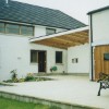 The extended car port canopy creates a sheltered space